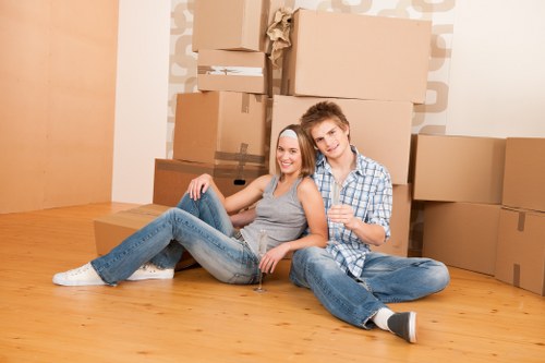 Students moving boxes in Southkensington with a removal van