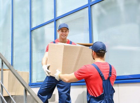 Man and van team preparing a safe lift with protective equipment