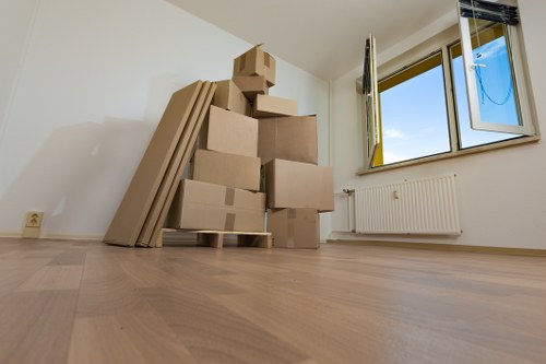 Student removals team carrying boxes in Southkensington street