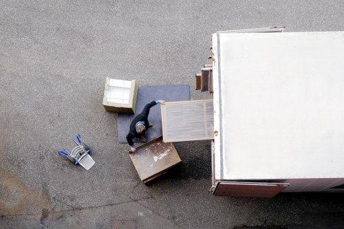 PPE-equipped removals staff assessing a moving route for safety