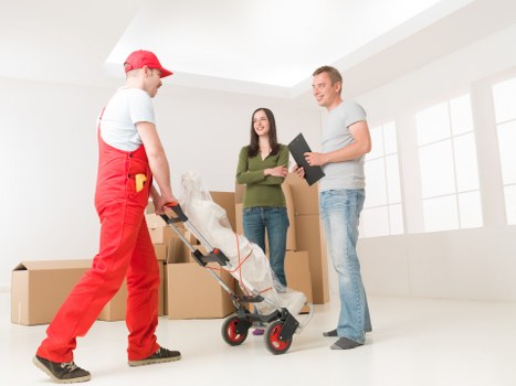 Commercial relocation setup with office furniture and boxes in South Kensington