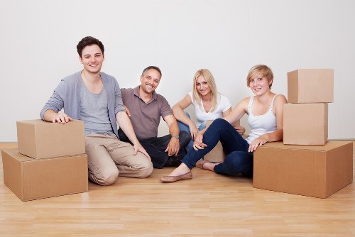 Professional movers handling furniture during an urgent relocation