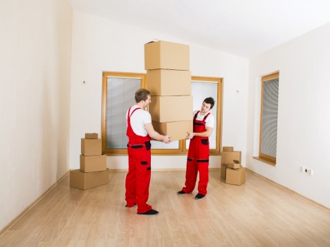 Office furniture and IT equipment being safely handled during relocation